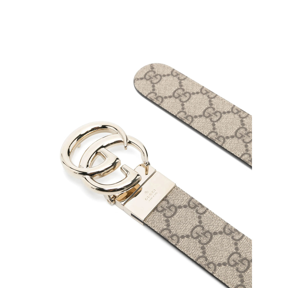 Gucci women's cream GG belt, close-up of polished silver buckle and keeper