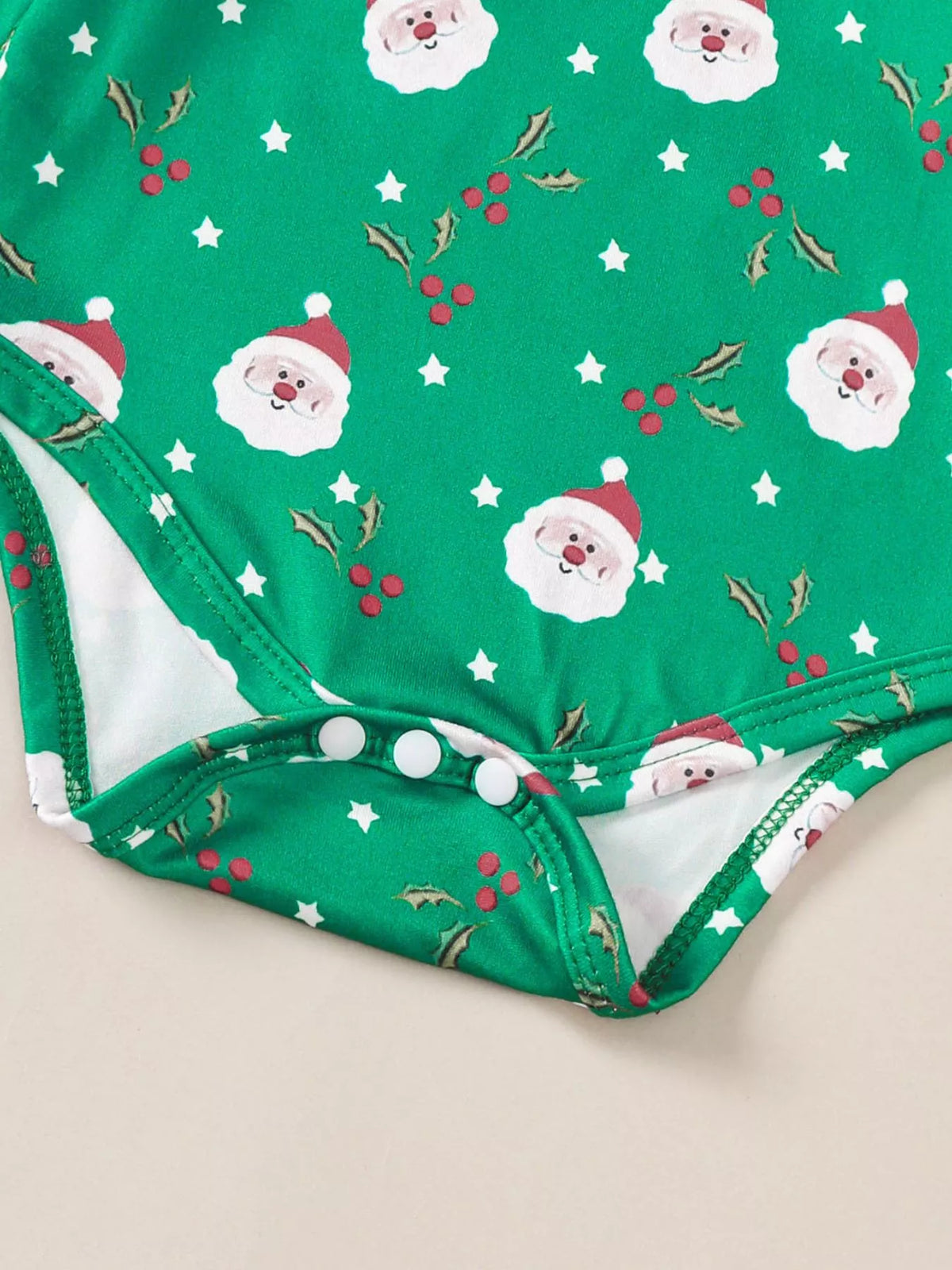 Dark green Christmas bodysuit with Santa face pattern and snap bottom