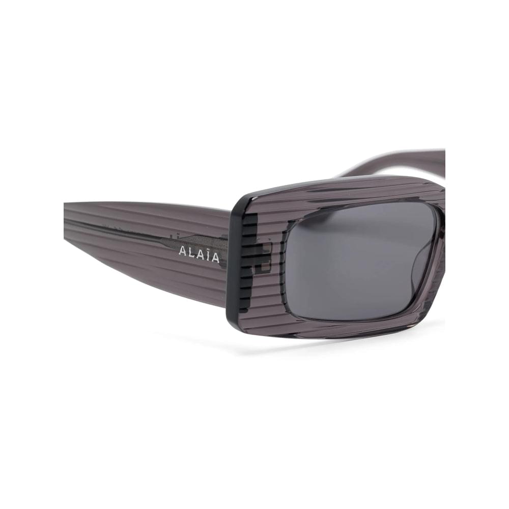 Alaïa gray women's sunglasses with rectangular frame and side logo