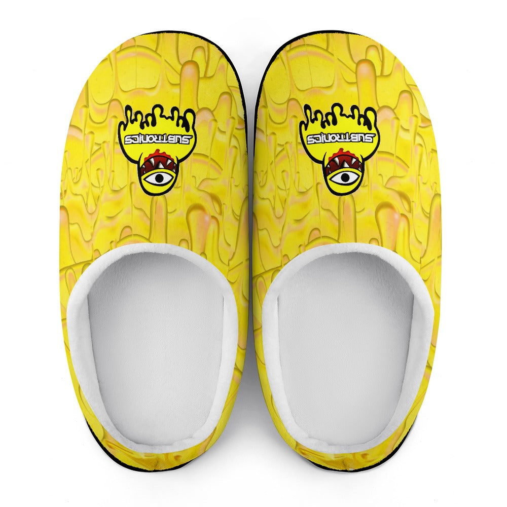 Pair of cotton slippers with yellow uppers featuring illustrated eye logo, white interiors