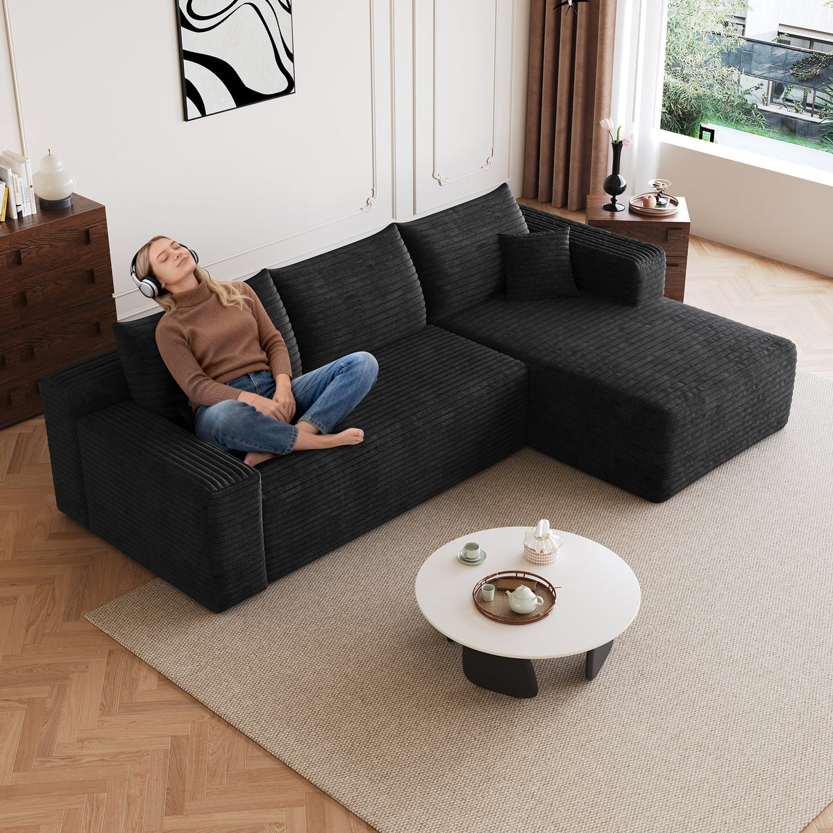 Black corduroy sectional sofa with chaise corner and deep seat cushions