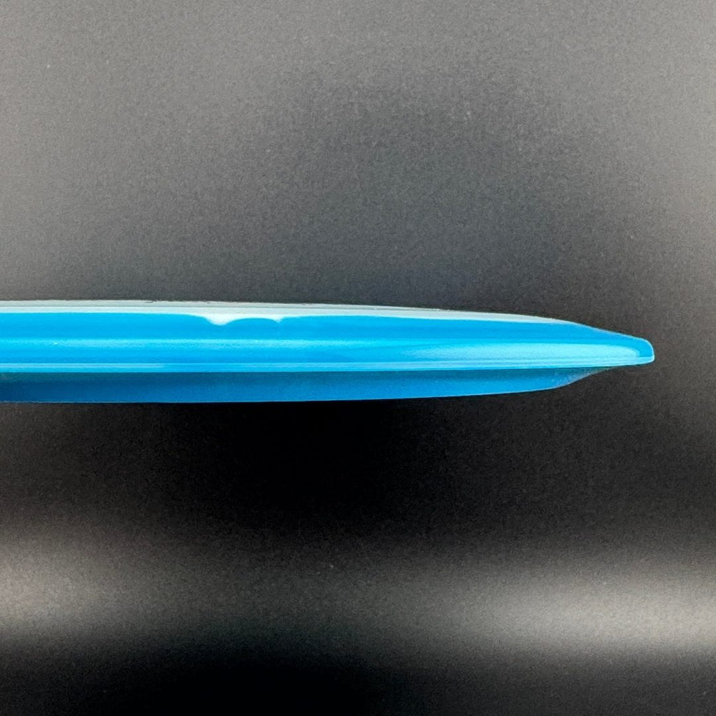 Blue and dark teal disc golf driver, side profile showing smooth rim