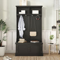 Black hall tree with coat hooks, open shoe bench storage, and top shelf compartments.