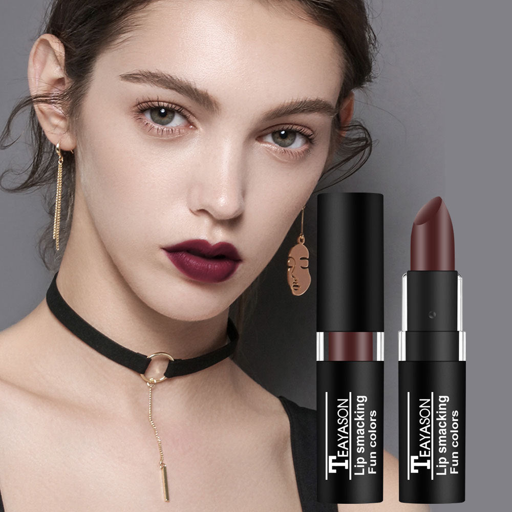 Woman with burgundy lipstick wearing TEAYASON lip color shades beside tubes