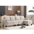 Beige linen sectional sofa with corner chaise and tufted back cushions, dark feet.