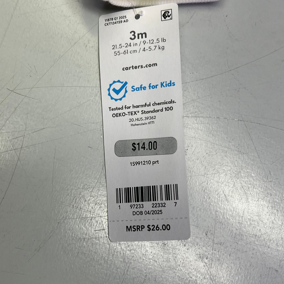 Clothing size tag for baby boy set, shows Safe for Kids testing info.
