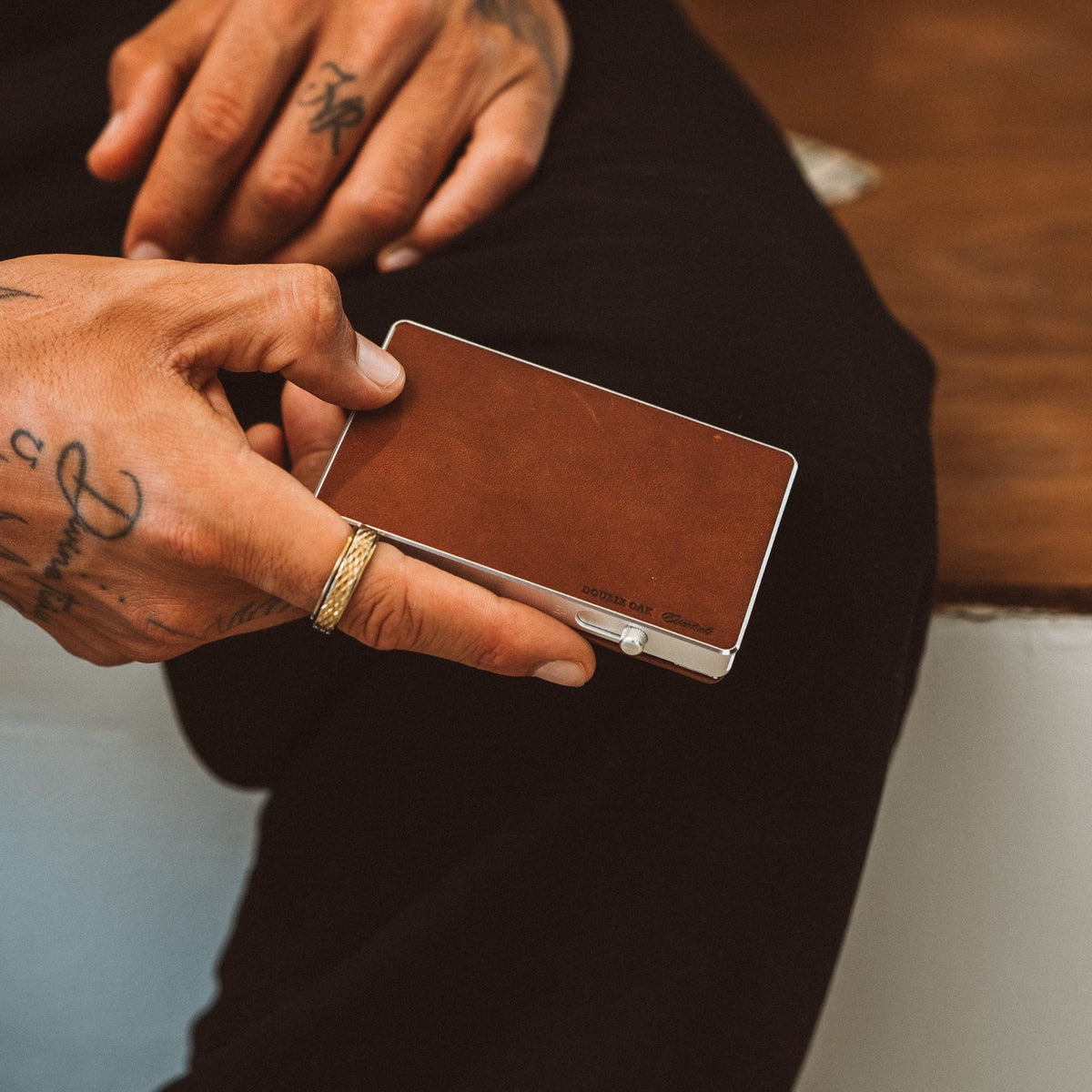 Brown leather mod wallet cardholder open with metal clasp and hinge
