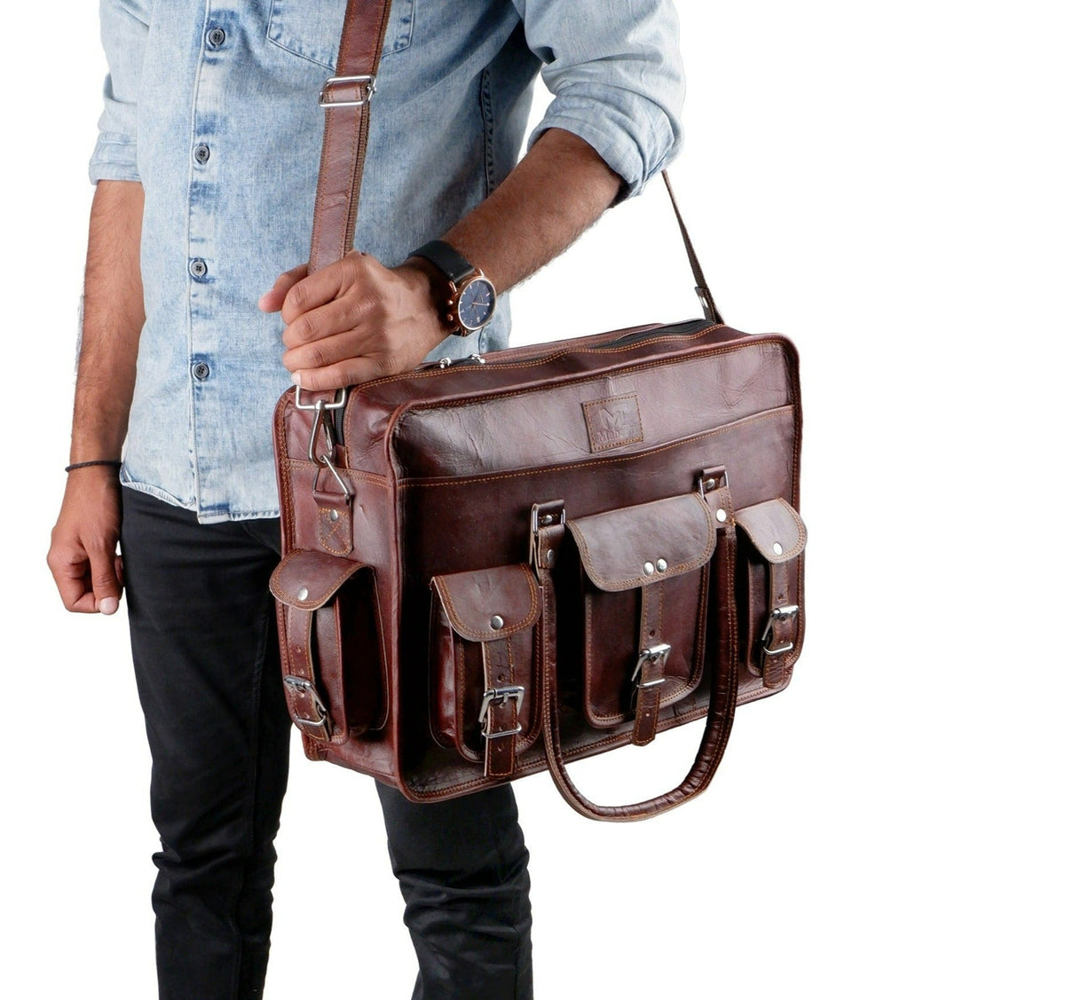Brown leather briefcase held by man, with shoulder strap and front organizer pockets