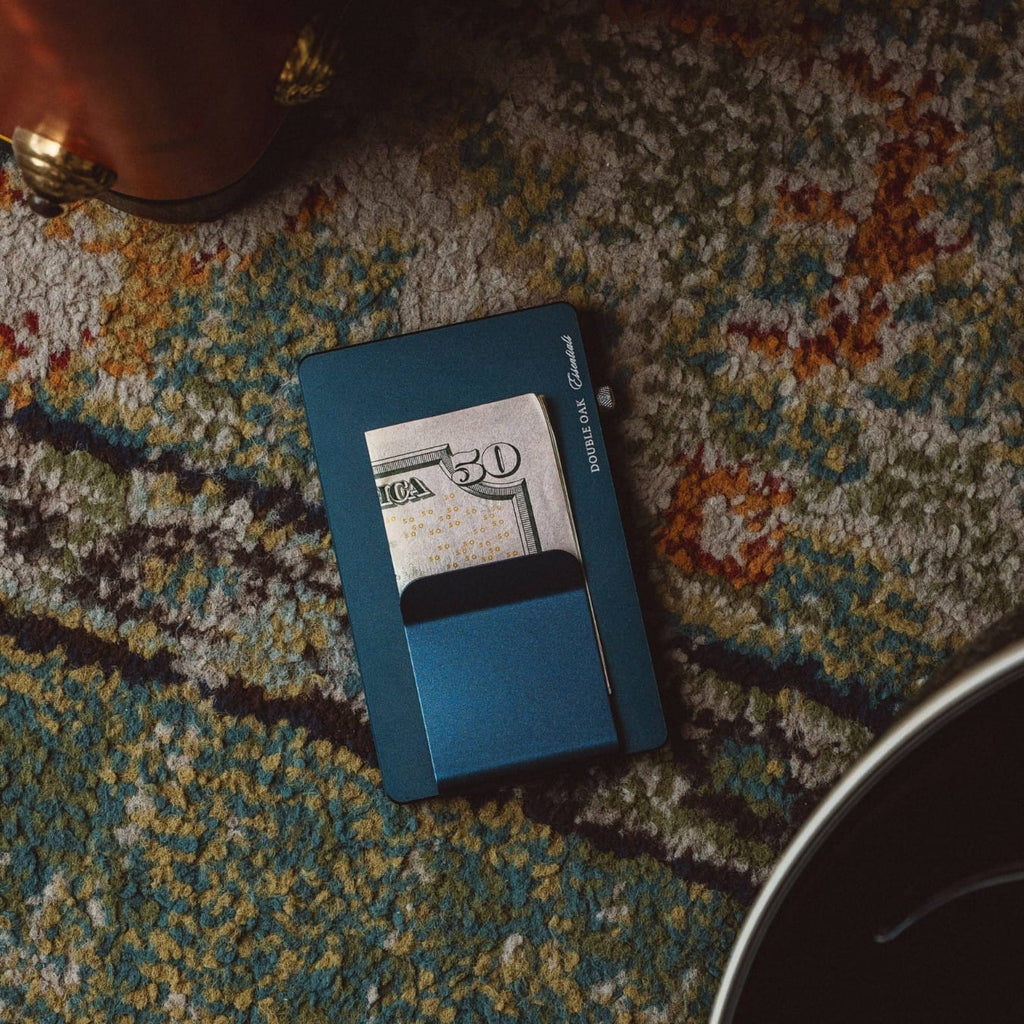 Teal pop-up cardholder with a card partially extended from the slot