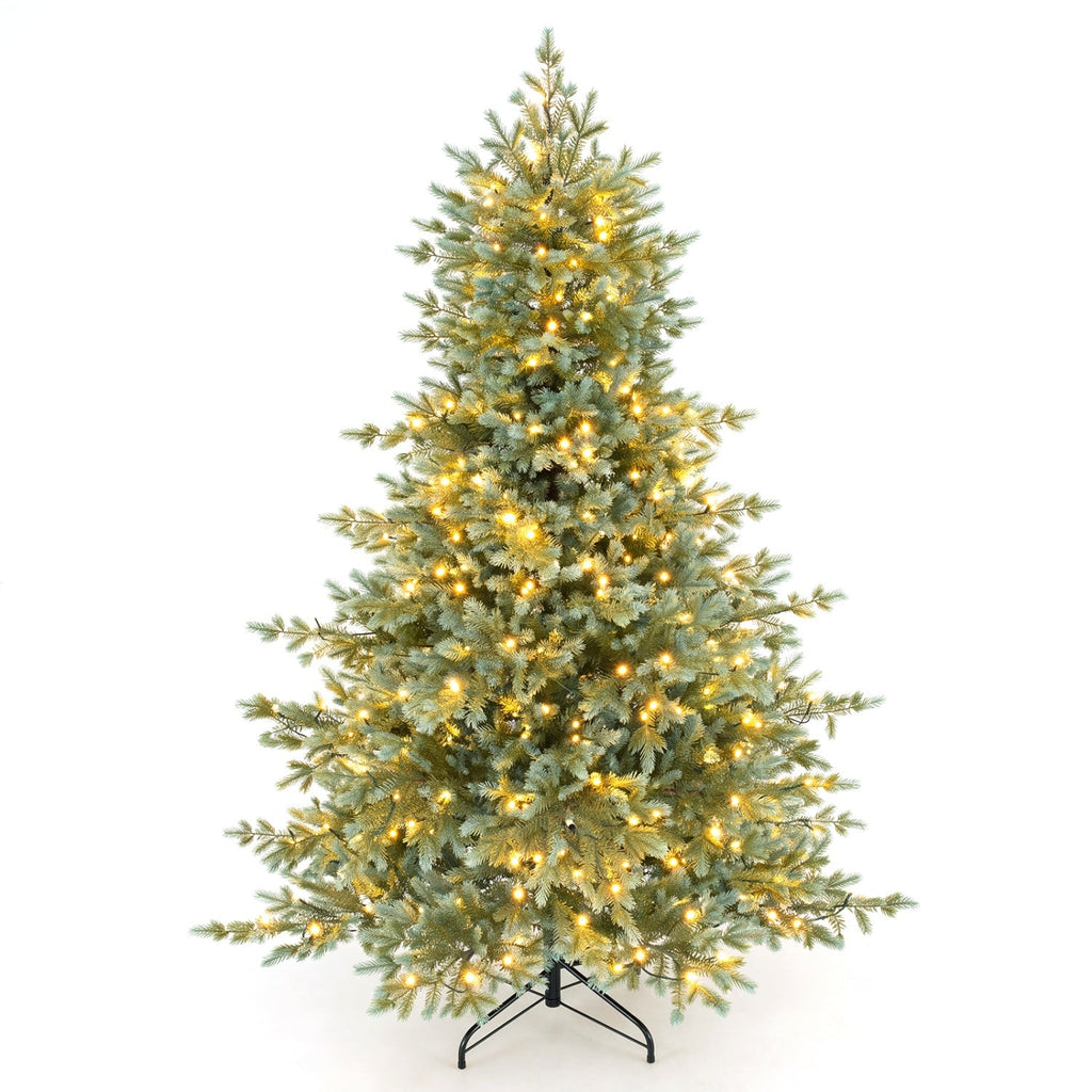 Artificial Christmas tree with green needles and warm white pre-lit LED lights