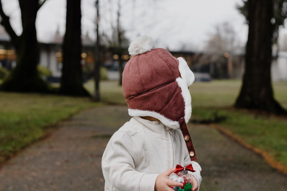 Burgundy kids trapper hat with white sherpa lining and top pom-pom
