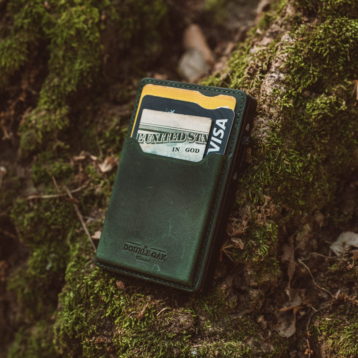 Green leather mod wallet with yellow trim and card in front sleeve