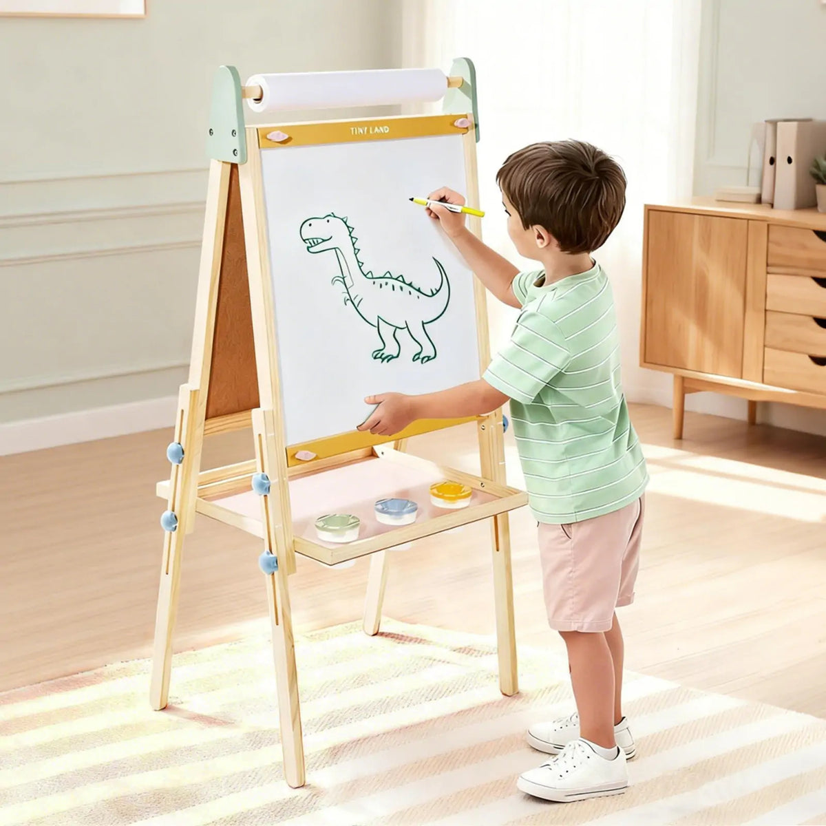 Kids art easel with wooden frame, white paper roll, and paint tray