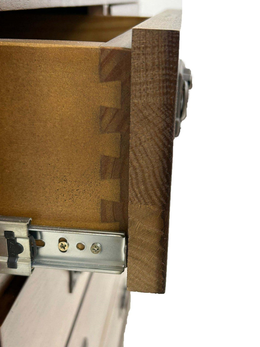 Wood dresser drawer hardware with metal slide and side panel, close-up