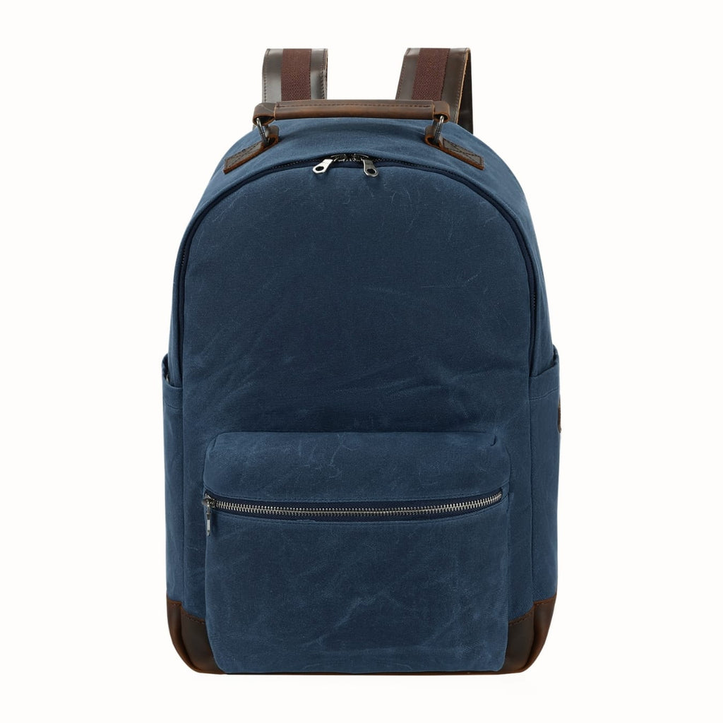 Blue canvas backpack with brown leather-look straps and front zip pocket