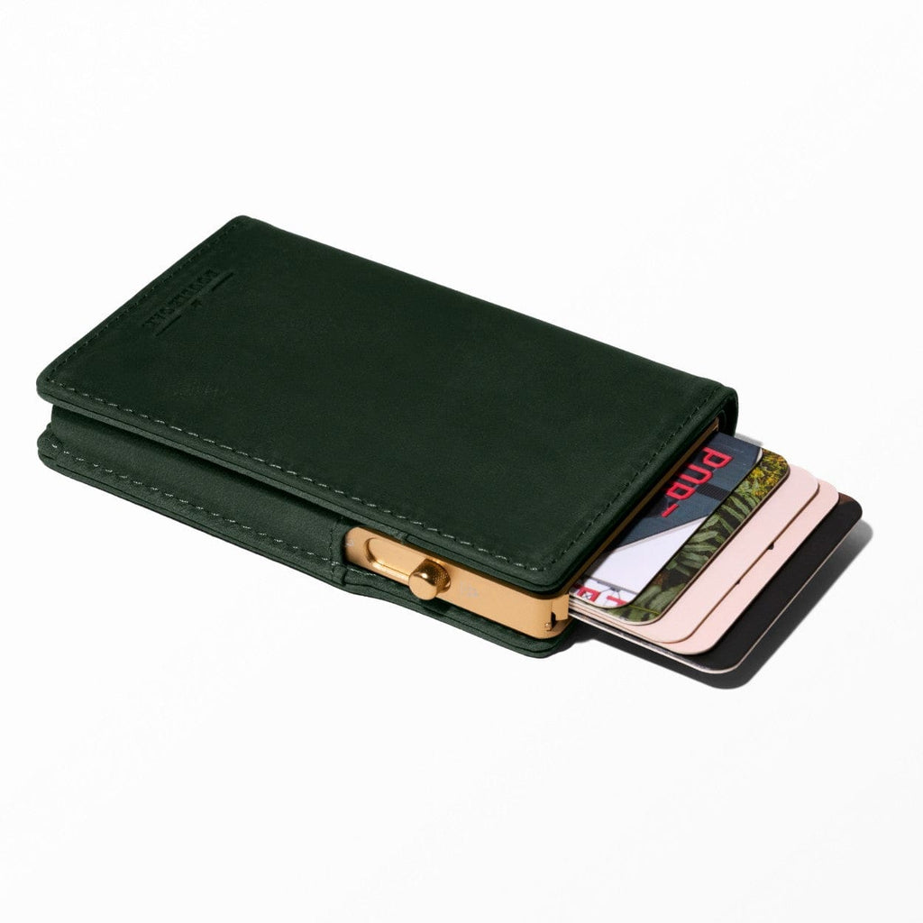 Dark green leather bifold wallet with gold-tone clasp and card slot visible
