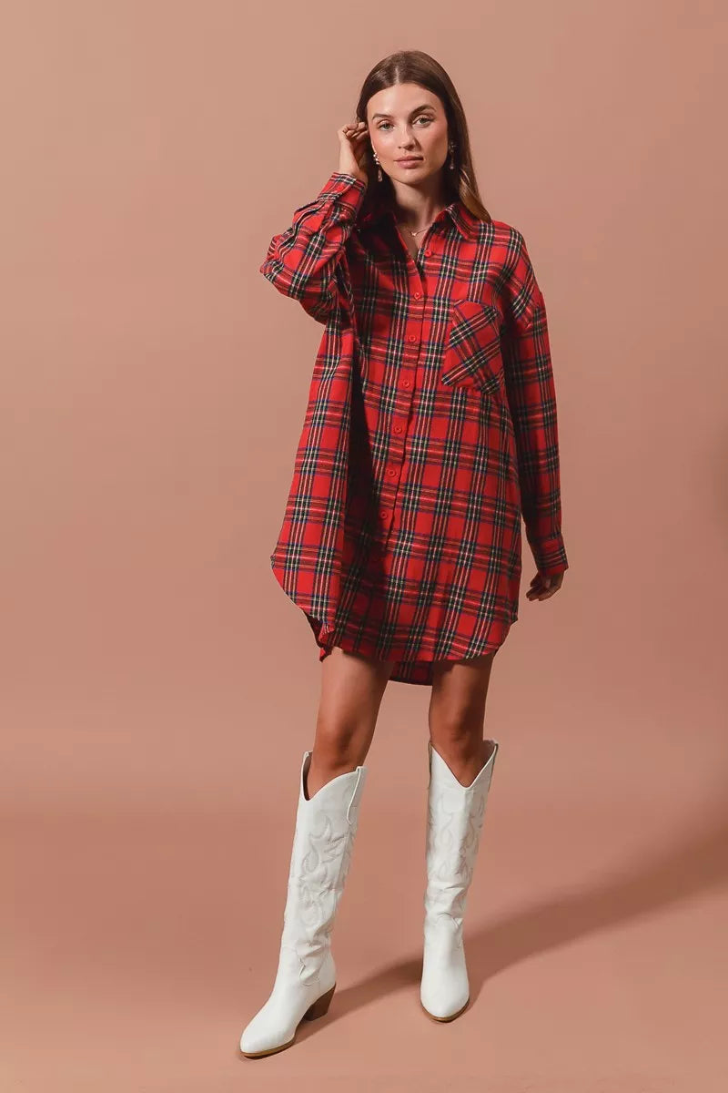 Red plaid button-up shirt dress with long sleeves, collared neckline, and cuffed hem.
