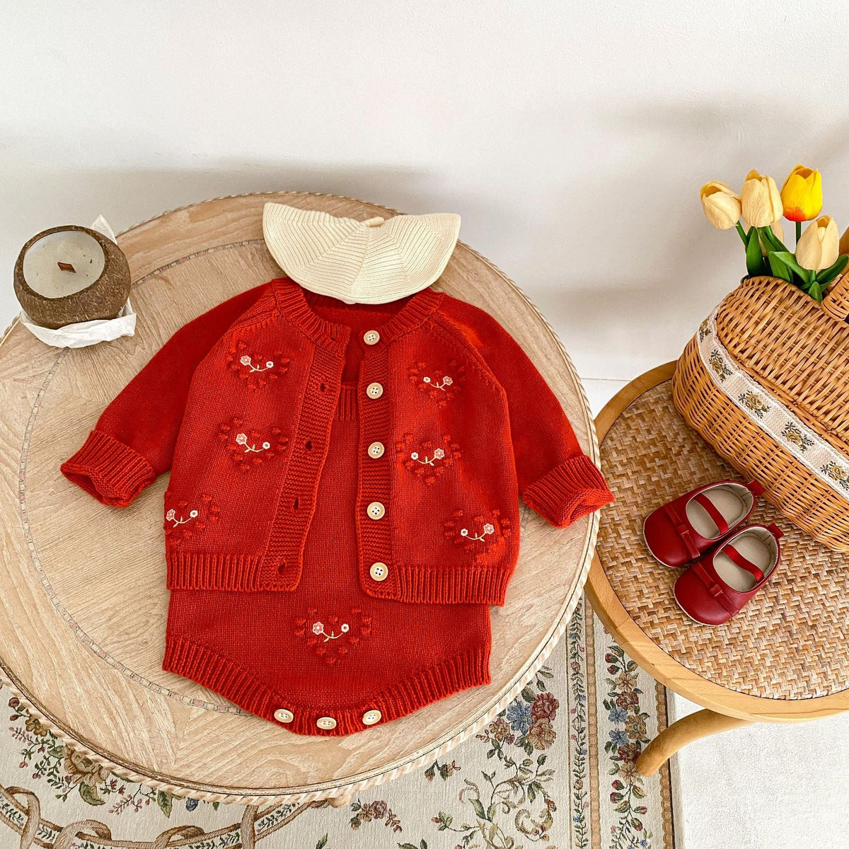 Red knit baby girl cardigan romper with cream scalloped collar, button front, heart embroidery