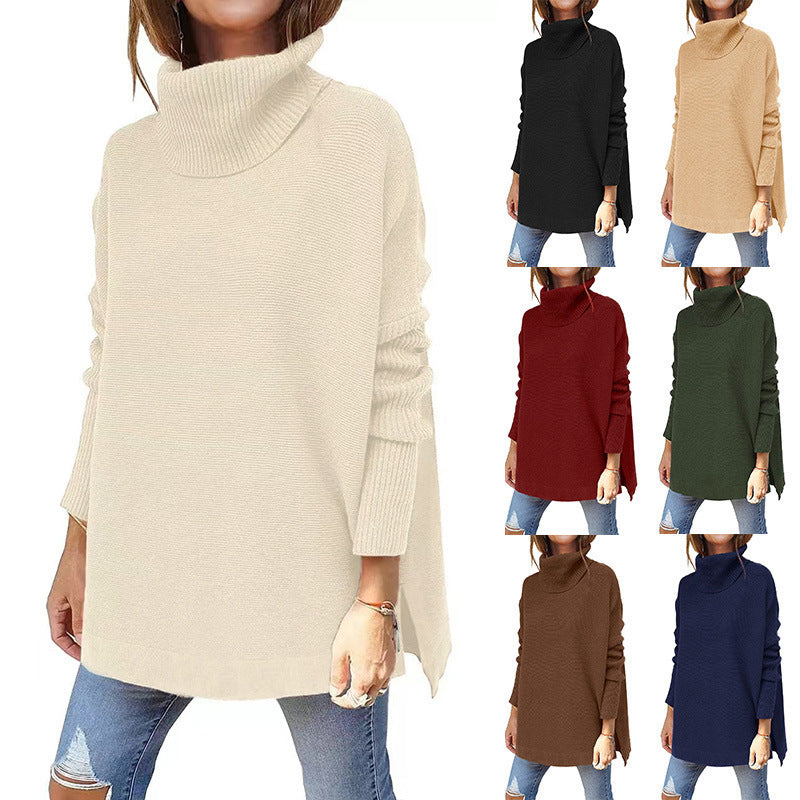 Cream ribbed knit turtleneck tunic sweater with batwing sleeves and side slit hem
