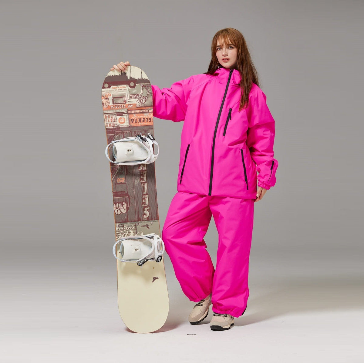 Bright pink unisex ski suit set with hooded jacket and matching loose pants