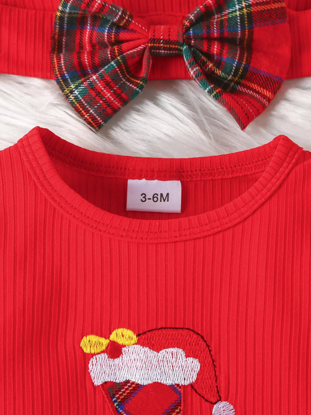 Red bodysuit with bow headband and '3-6M' size label