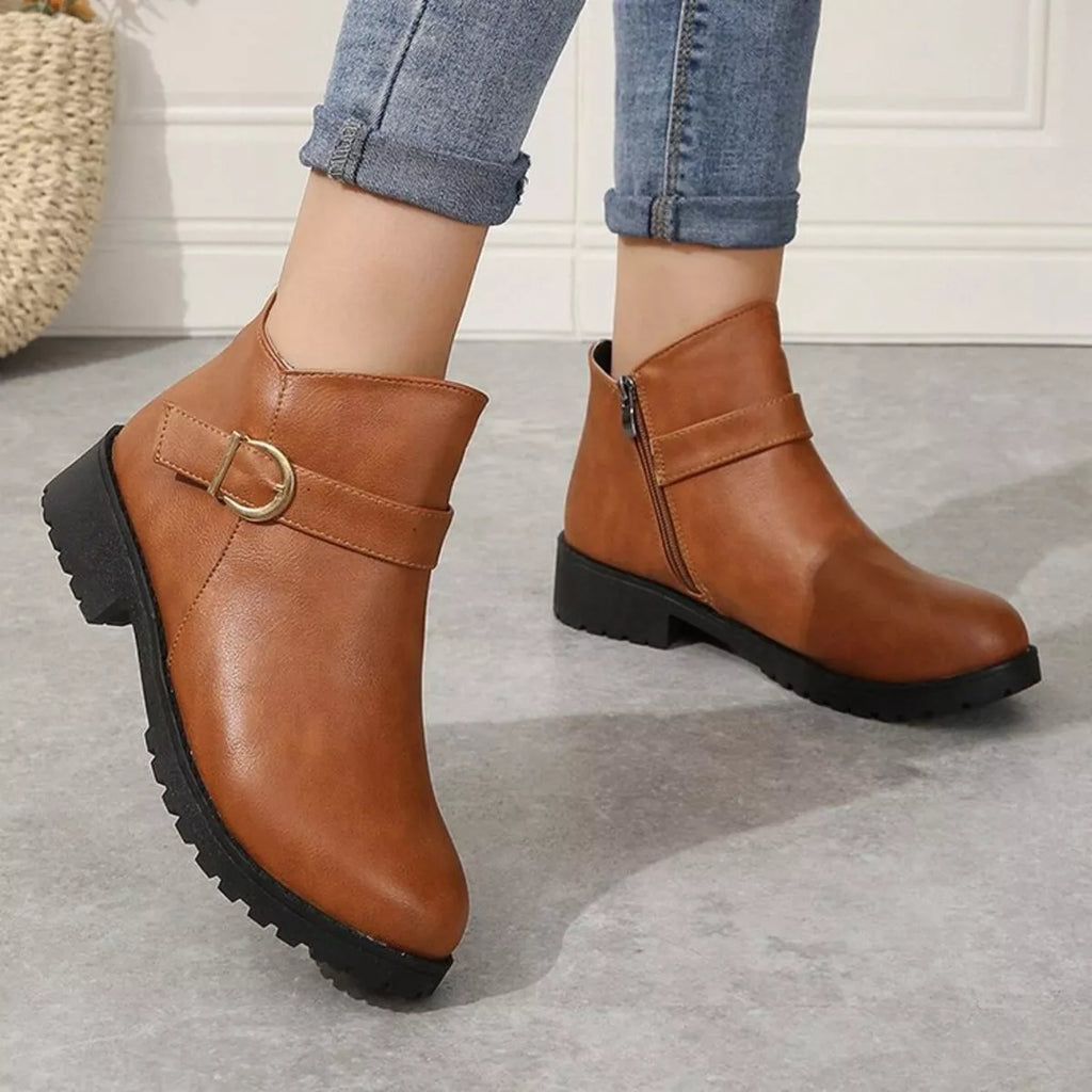 Caramel ankle boots with side zipper and gold buckle strap, rugged lug sole