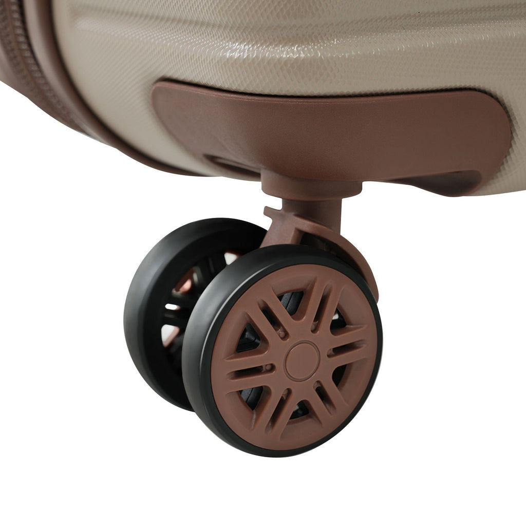 Hard-shell luggage caster wheel with brown center and black rim