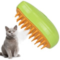 Handheld lime green steam brush with orange bristles for cat grooming