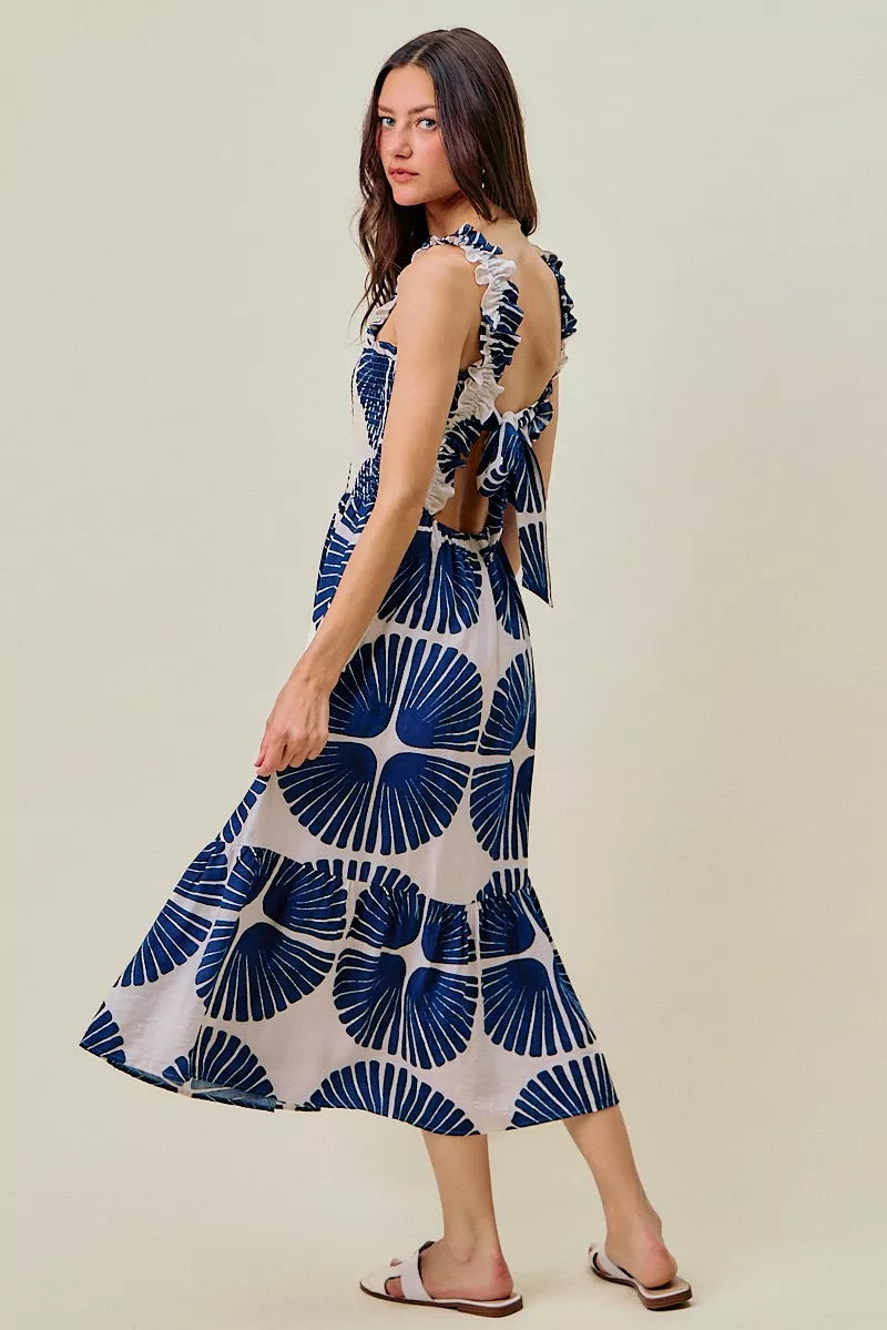 Sleeveless navy and white abstract print tiered midi dress, side view