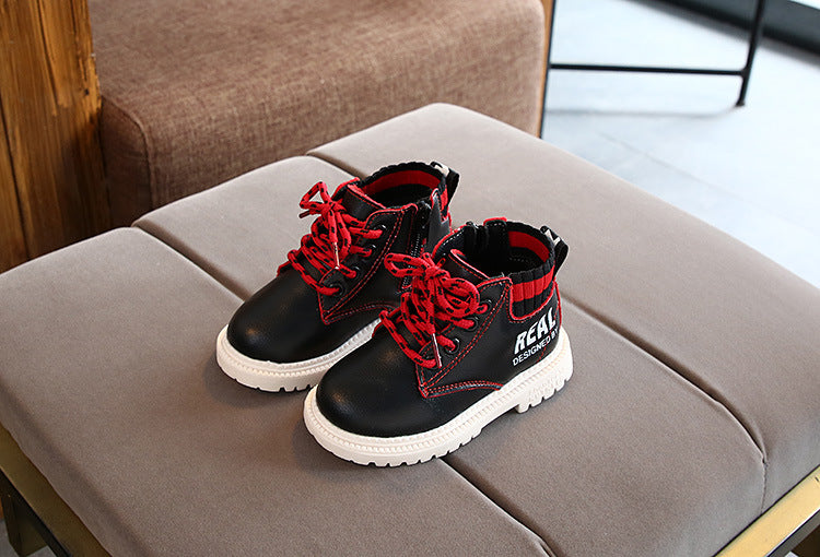 Kids black lace-up ankle boots with red laces, fuzzy lining, striped collar, white tread sole