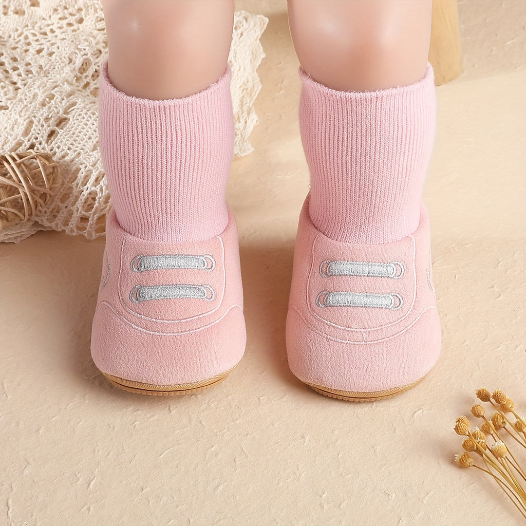 Pink baby sock booties with bear face, front lace detail, and ribbed cuffs