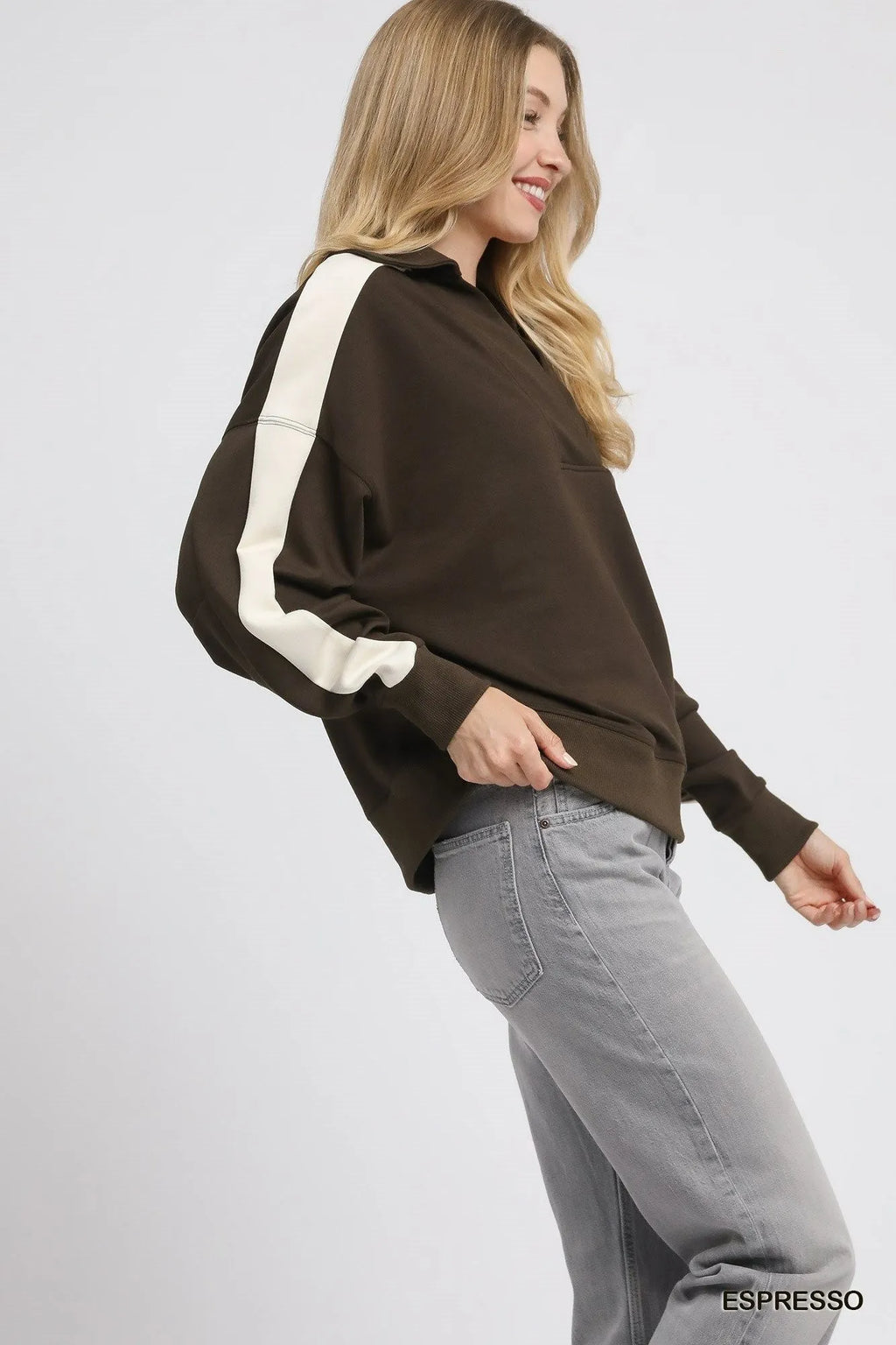 Dark brown polo sweatshirt with cream sleeve panels and relaxed fit