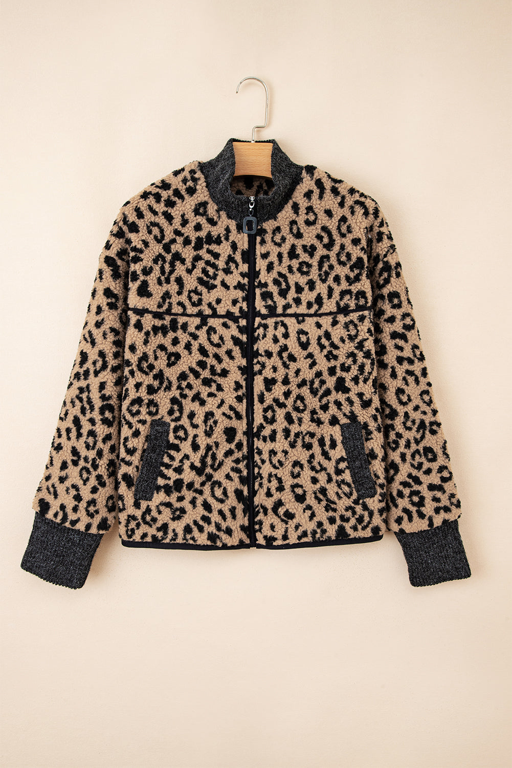 Leopard-print fleece zip-up jacket on hanger, stand collar with front zipper and pockets.