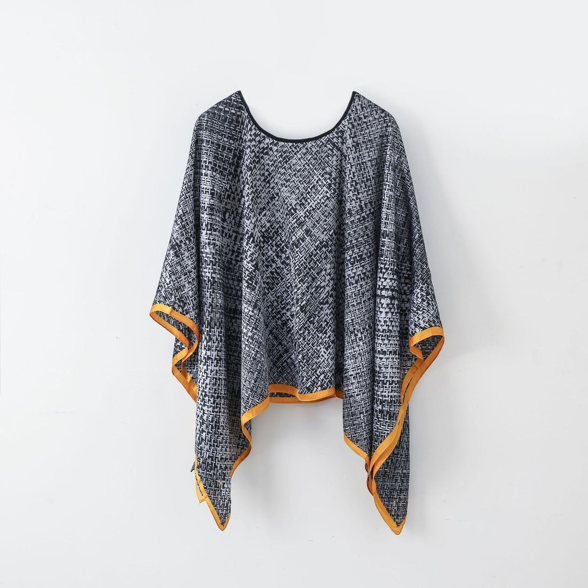 Women's textured knit-look pullover shawl with batwing sleeves, black and gray with orange trim