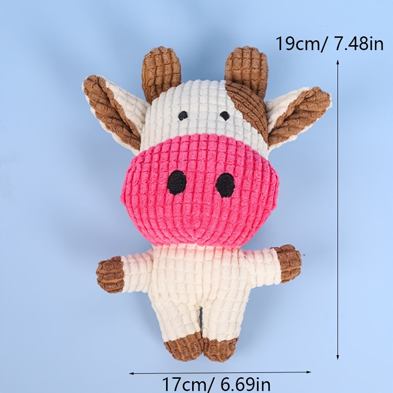 Pink cow-shaped plush dog toy with white body and brown hooves