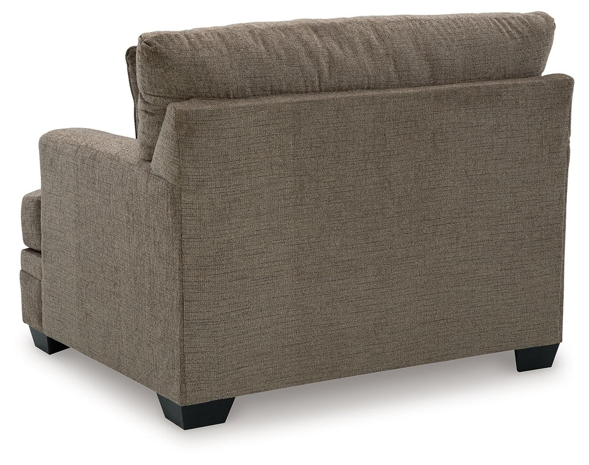 Upholstered living room armchair with track arms and dark legs, gray-brown fabric