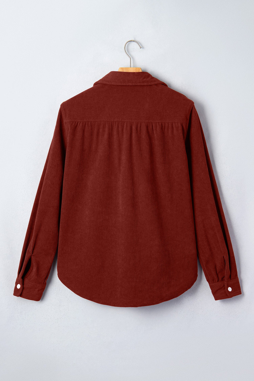 Clay corduroy long-sleeve button-up shirt back view with yoke seam and full sleeves.