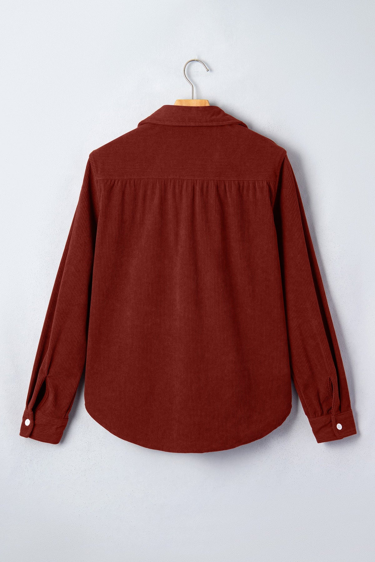 Clay corduroy long-sleeve button-up shirt back view with yoke seam and full sleeves.