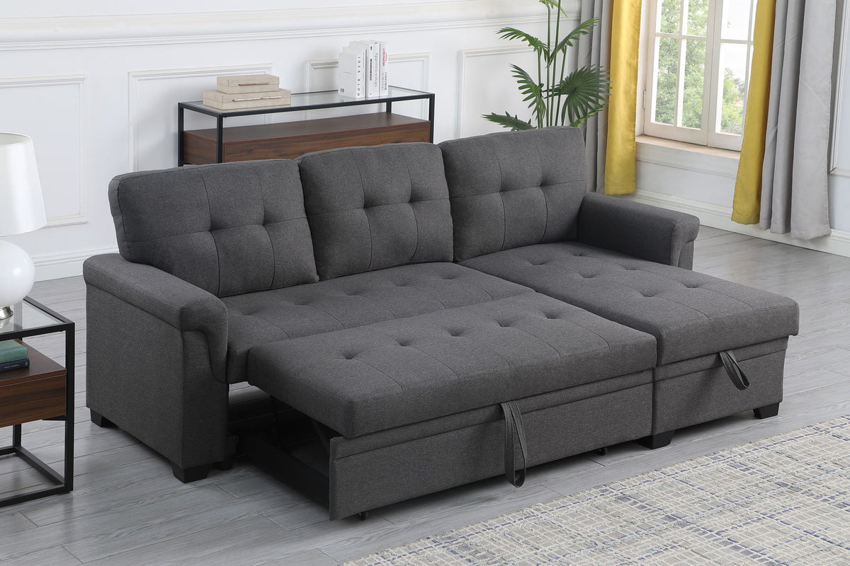 Dark gray reversible sleeper sectional sofa with tufted back and storage chaise