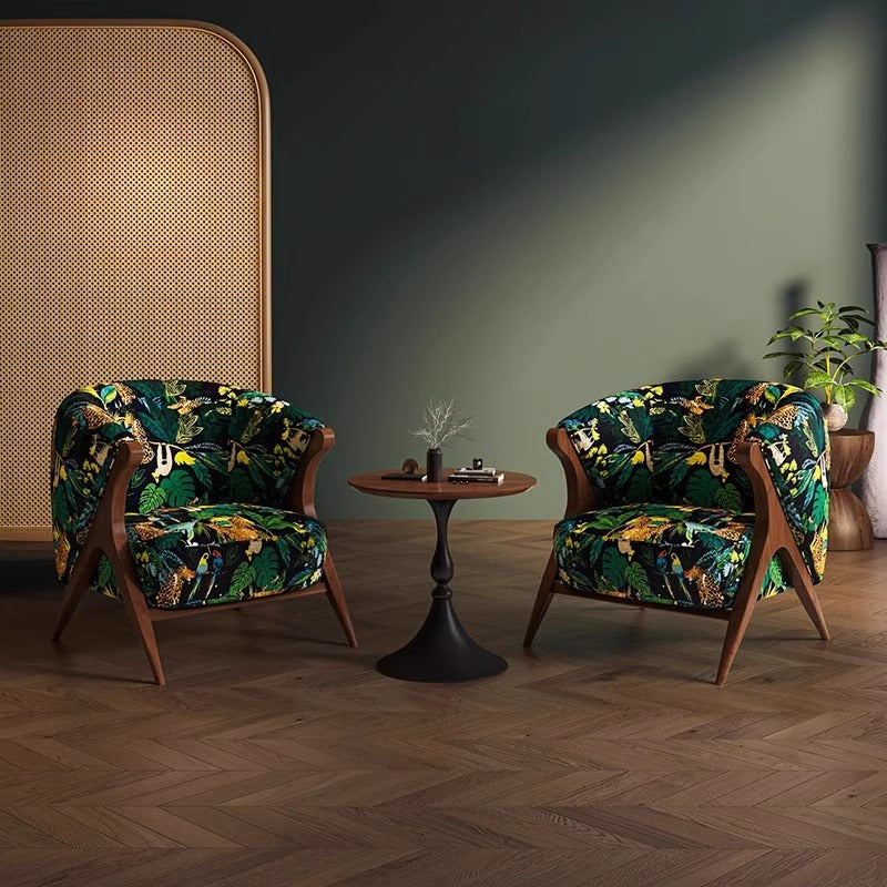 Pair of patterned lounge chairs with wood frames and curved barrel backs