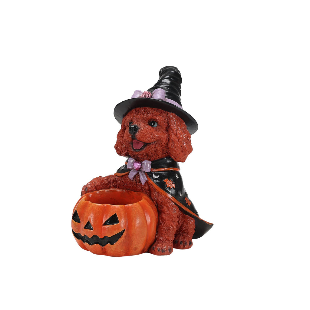 Side view of a brown dog witch figurine with an empty pumpkin bowl