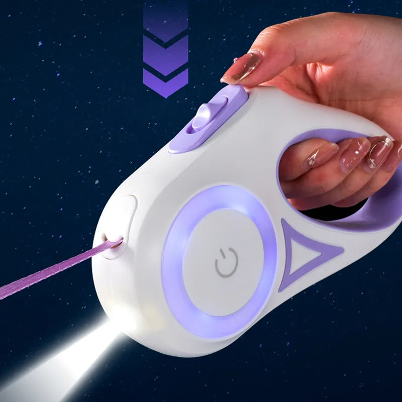 Purple retractable pet leash with glowing ring control button, hand adjusting the leash