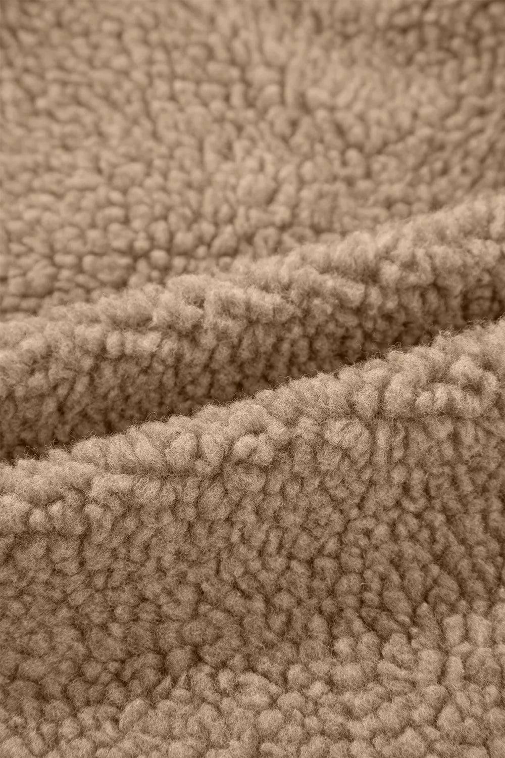 Fleece fabric texture in khaki brown, close-up surface detail