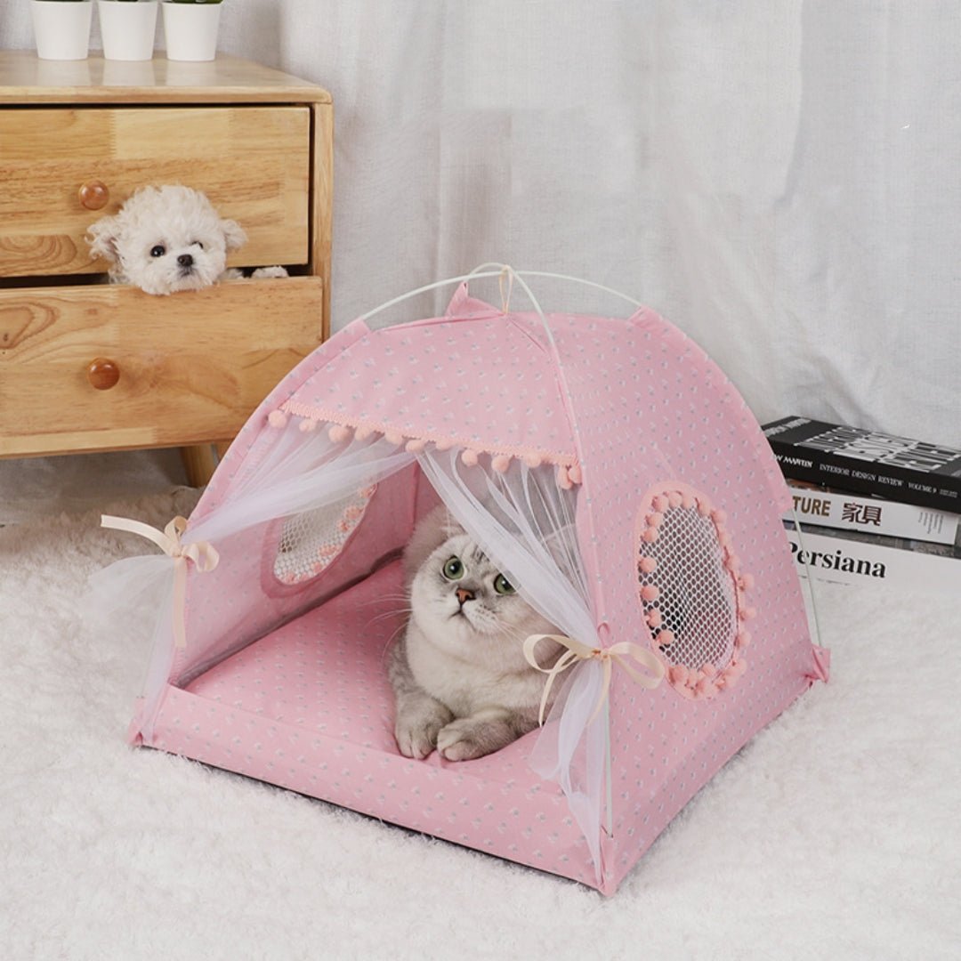 Foldable outdoor pet tent in light pink with mesh windows and bow ties