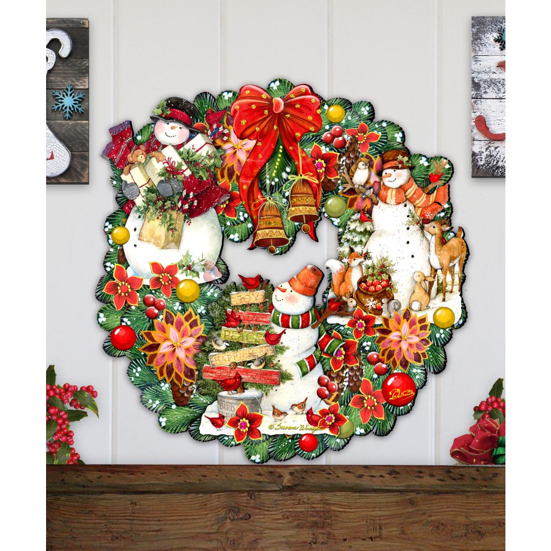 Red bow Christmas wreath with two snowmen, Santa, reindeer, and colorful holiday flowers