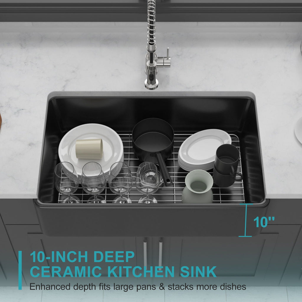Black ceramic single-bowl kitchen sink interior with rack and stacked dishware