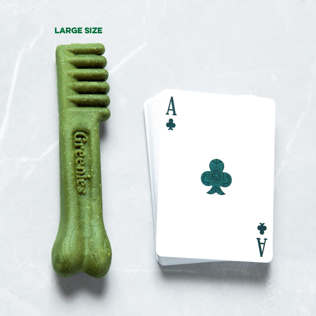 Greenies large green dental chew next to an Ace playing card for size