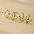 Gold bezel hoop earrings set with small round stones, shown as matching pairs