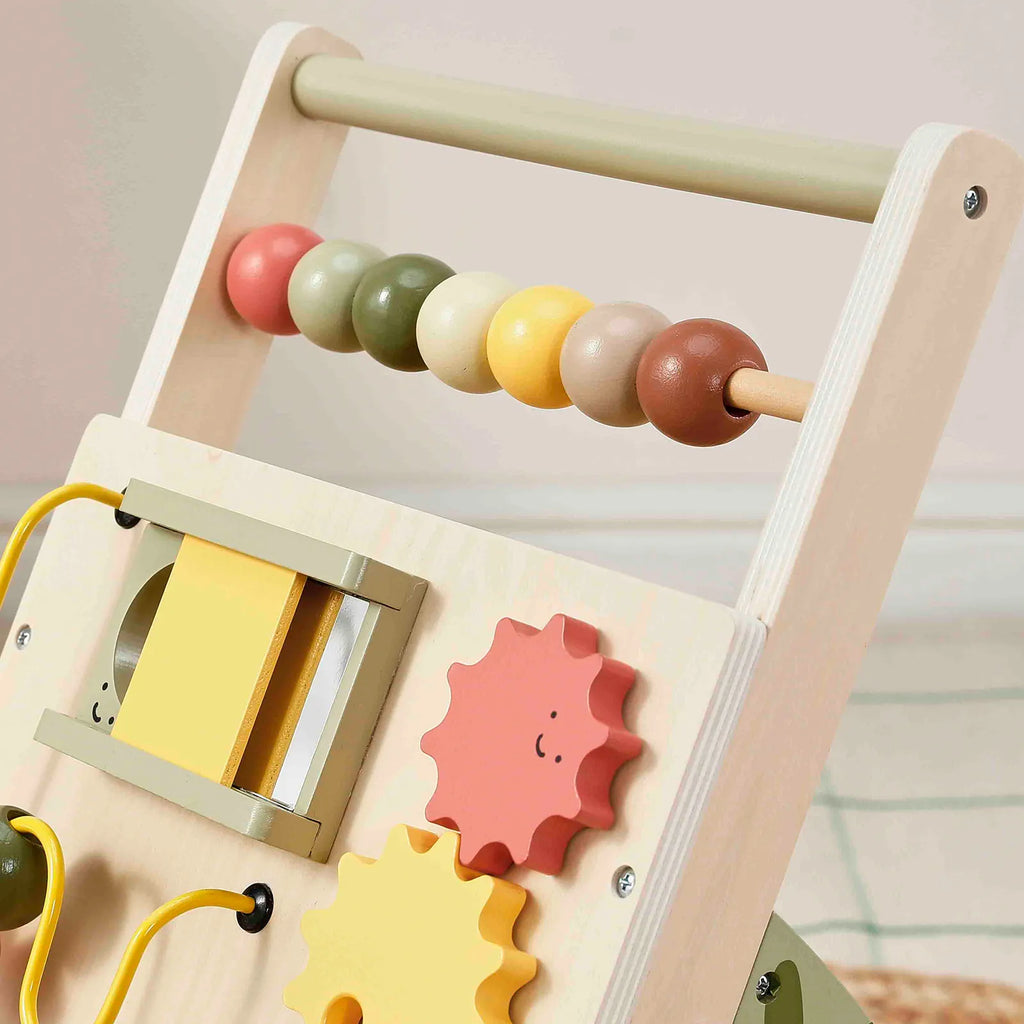 Close-up of wooden baby walker bead roller and side activity door with gear pieces