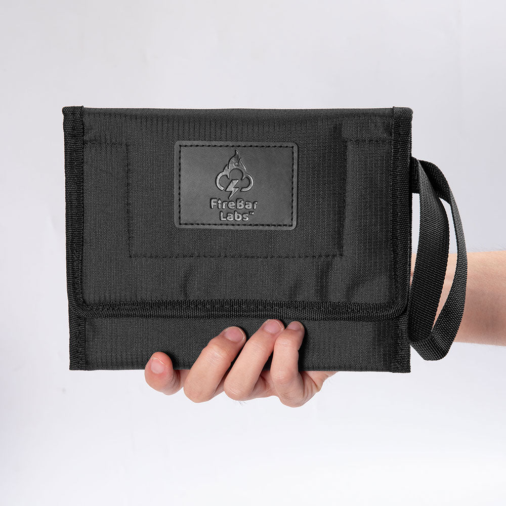 Smell proof travel wallet in black with FireBar Labs patch and wrist strap
